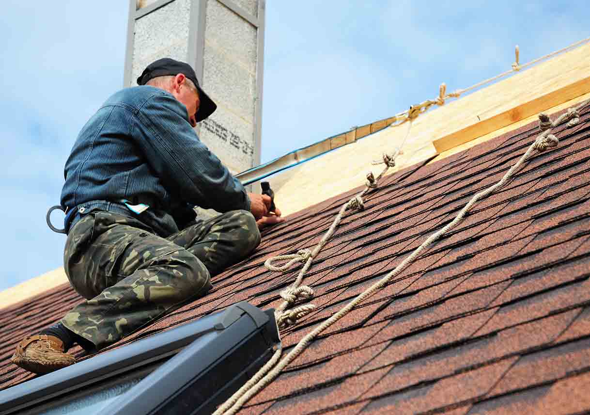 professional roofer at work min